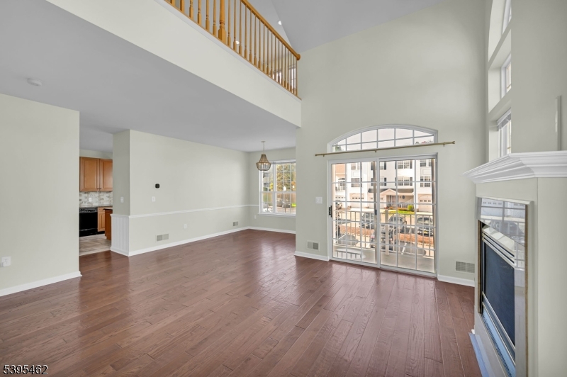 11 Timothy Court Morristown, NJ 07960 - Photo 9 of 30 an empty room with wooden floor fireplace and windows