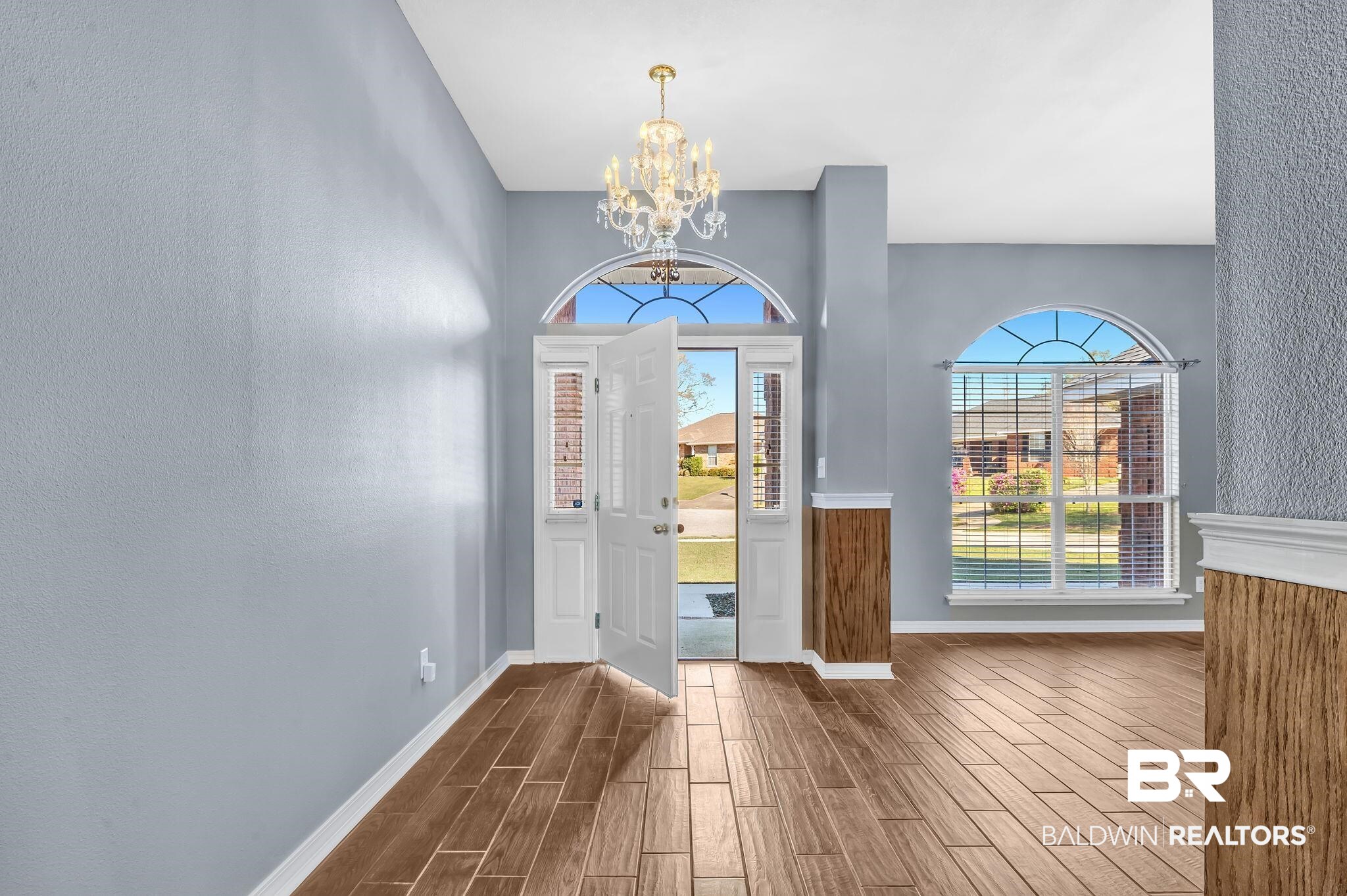 16444 Hamlet Lane Foley, AL 36535 - Photo 10 of 49 Foyer with baseboards, a wealth of natural light, a chandelier, and dark wood finished floors