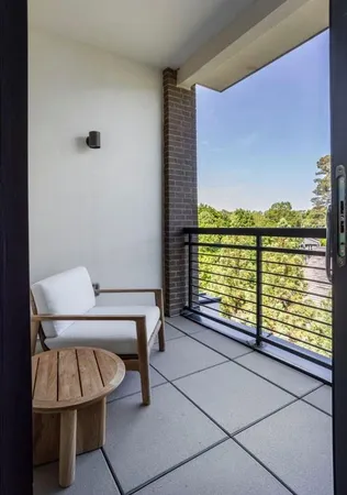 a view of a balcony with an outdoor space
