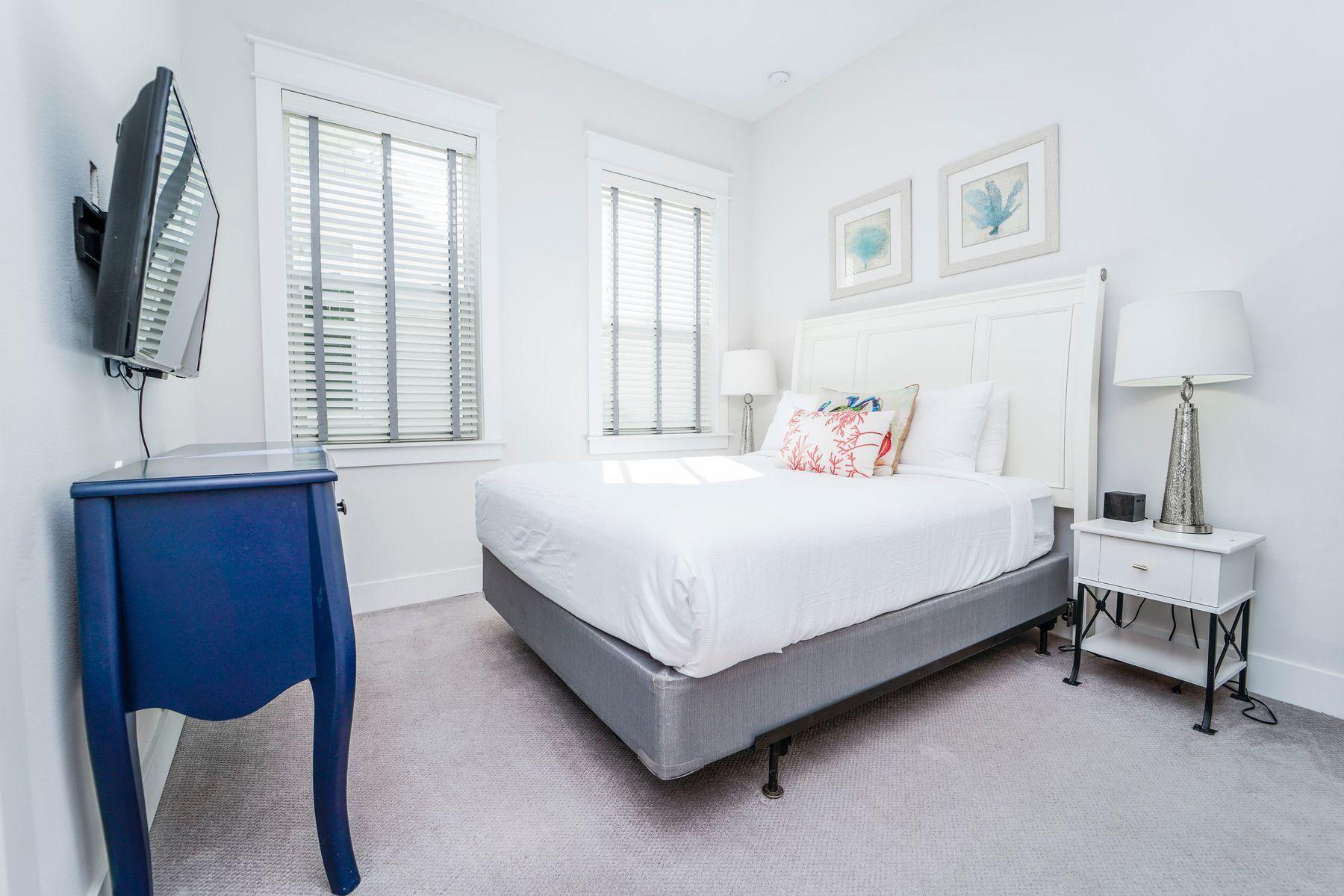 58 York Ln Inlet Beach, Unit B Inlet Beach, FL 32461 - Photo 13 of 24 a bedroom with a bed and a window