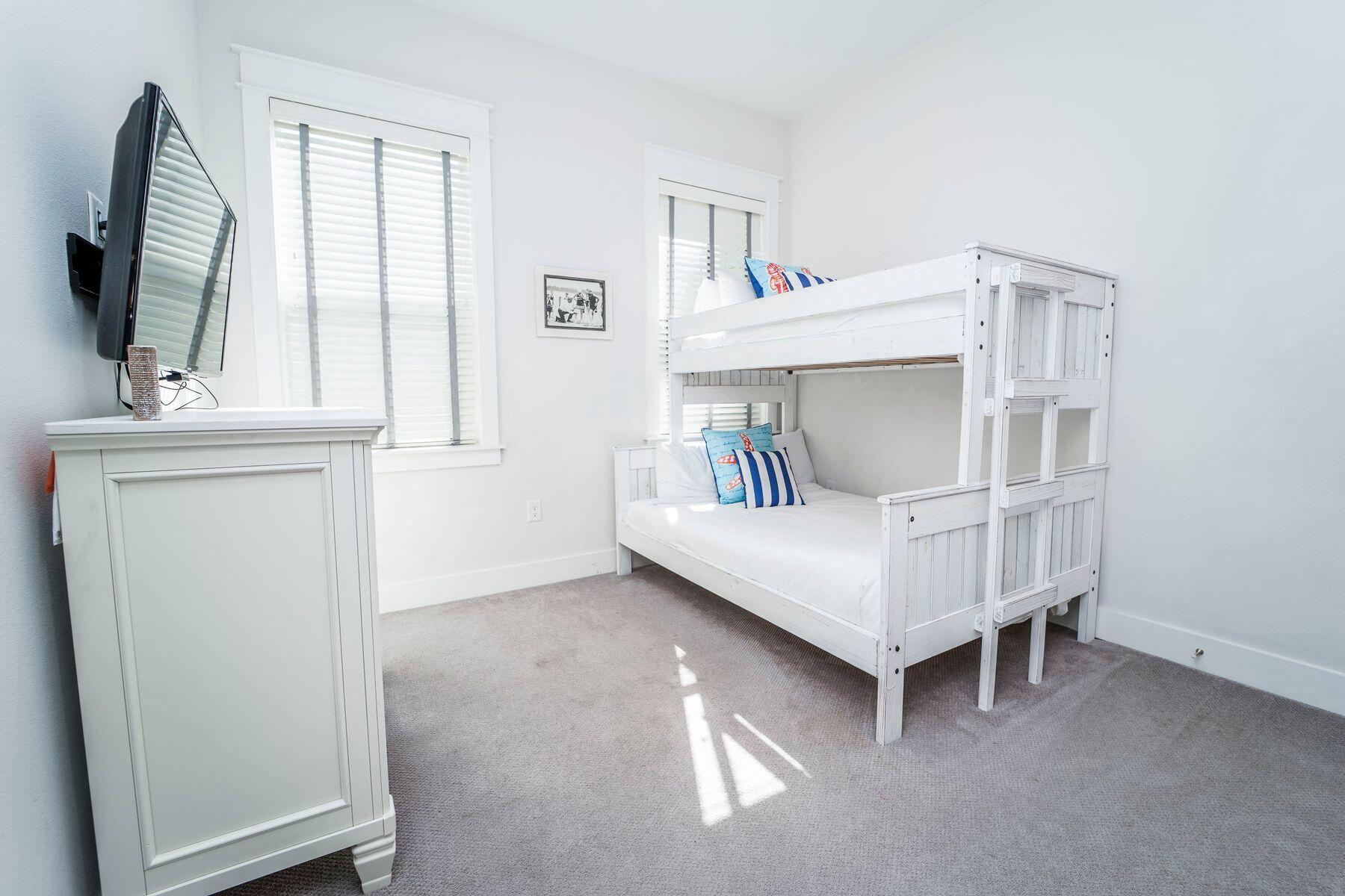 58 York Ln Inlet Beach, Unit B Inlet Beach, FL 32461 - Photo 15 of 24 a bedroom with a bed and a window