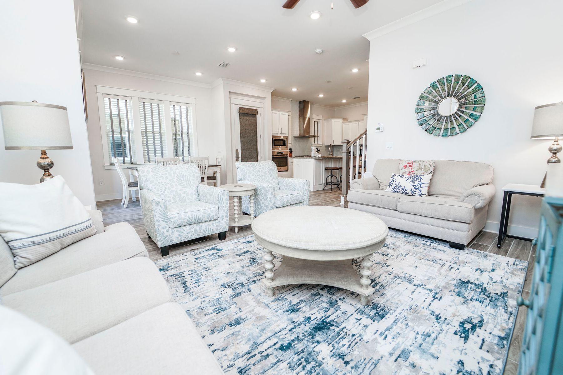 58 York Ln Inlet Beach, Unit B Inlet Beach, FL 32461 - Photo 2 of 24 a living room with furniture and a large mirror
