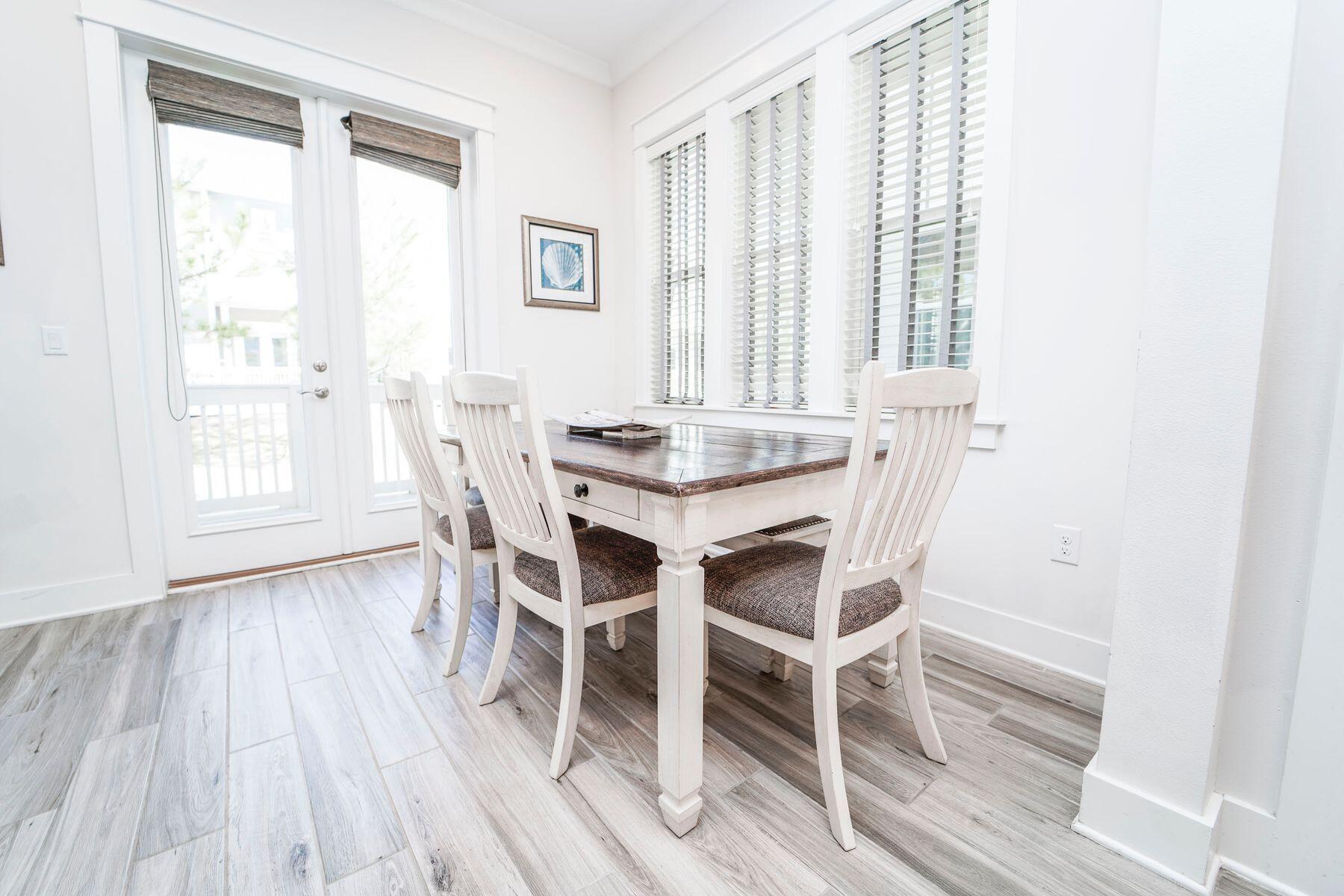 58 York Ln Inlet Beach, Unit B Inlet Beach, FL 32461 - Photo 8 of 24 a dining room with furniture and wooden floor