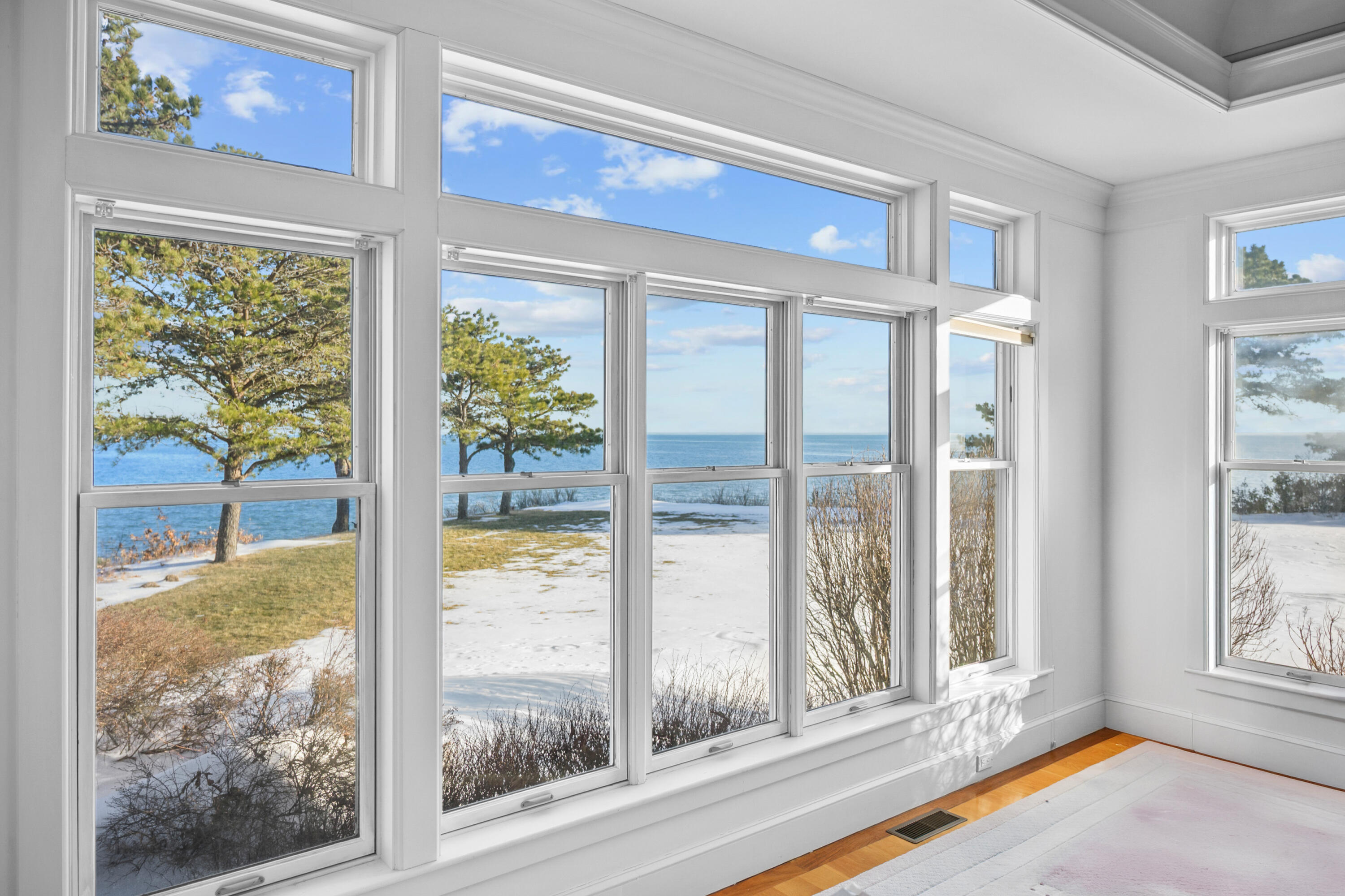 1412 Main Street Cotuit, MA 02635 - Photo 11 of 11 a view of a livingroom with wooden floor and front door