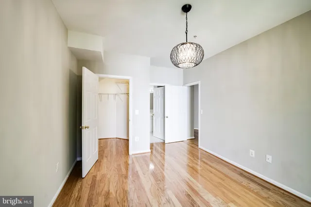 a view of a room with wooden floor and staircase
