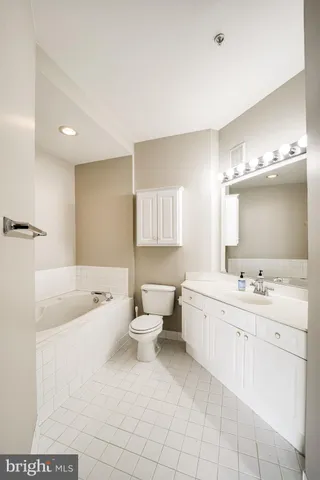 a bathroom with a sink a toilet and bathtub