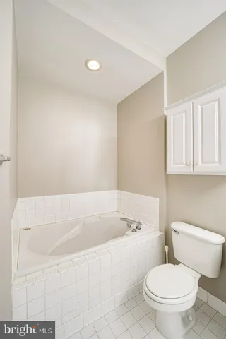 a bathroom with a bathtub and toilet