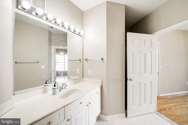 a bathroom with a double vanity sink mirror and double