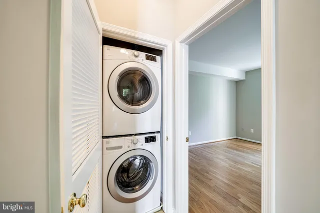 a view of a hallway with washer and dryer