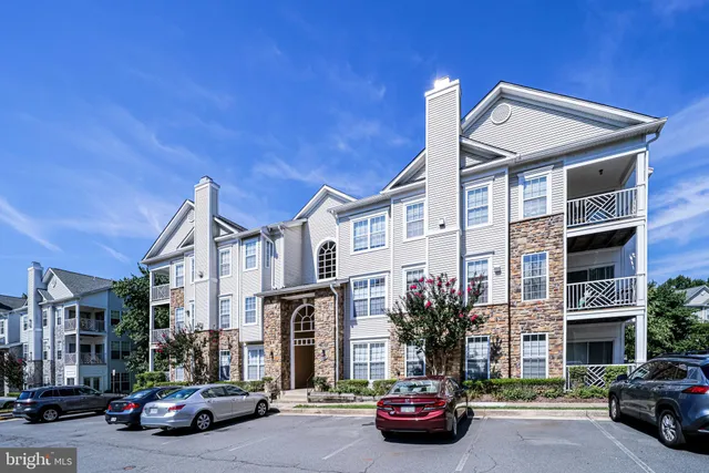 a view of a street that has couple of cars parked on the road