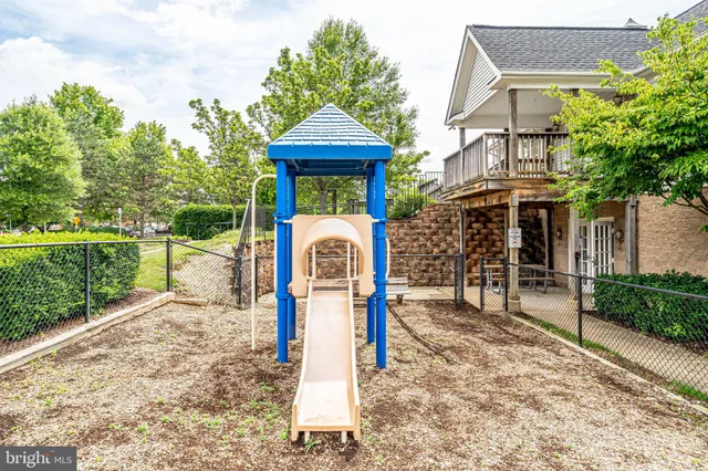 a front view of a house with a garden and plants