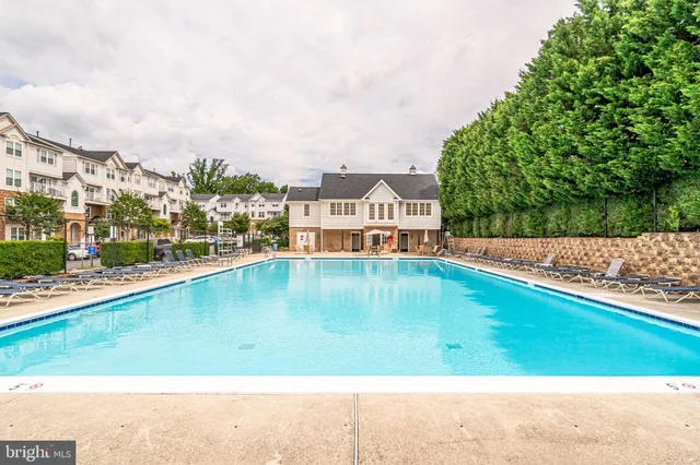 a view of swimming pool from a balcony