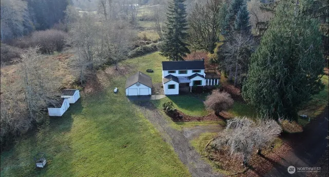 a view of a chairs and table in the garden