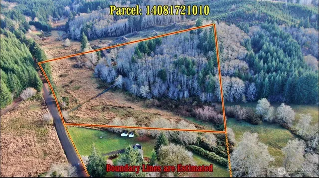 a street sign that is on a wooden wall