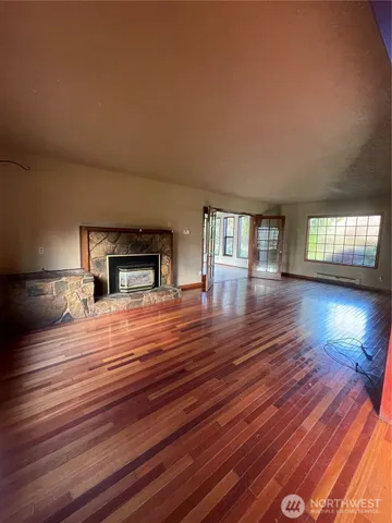 a room with furniture and a wooden floor