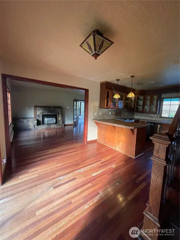 a view of living room kitchen and a chandelier
