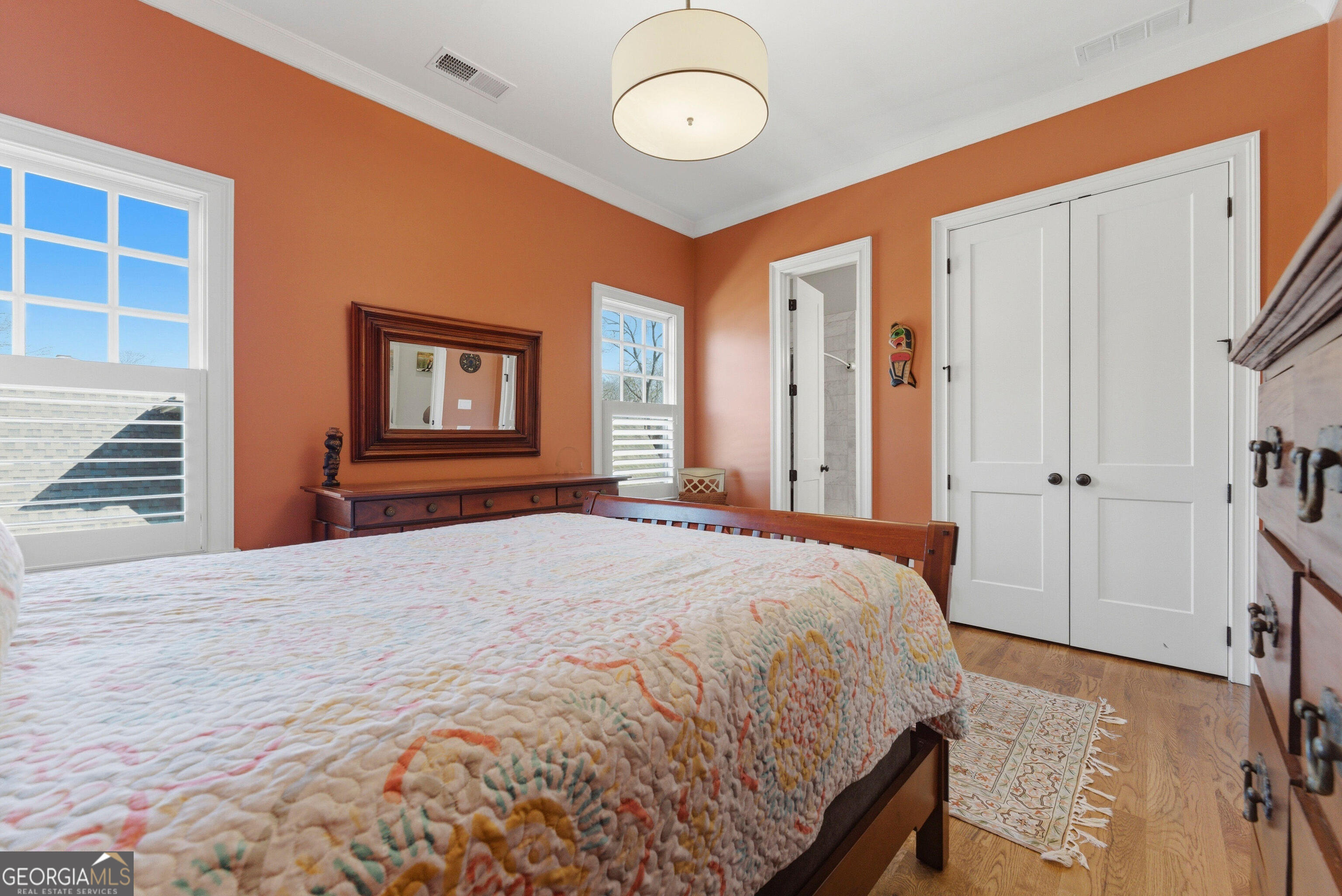 1205 Oldfield Road Decatur, GA 30030 - Photo 20 of 37 a bedroom with a bed and a chandelier