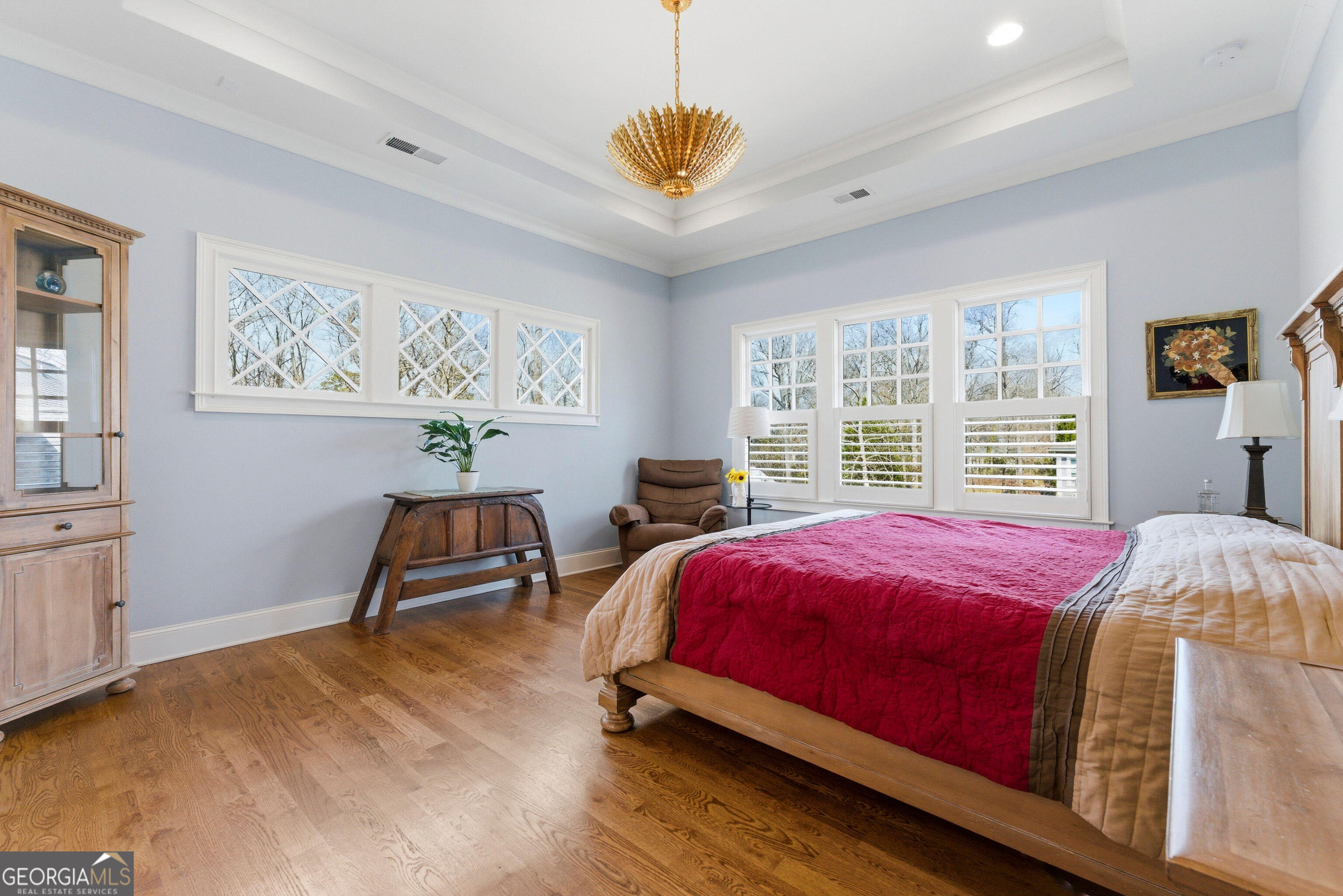 1205 Oldfield Road Decatur, GA 30030 - Photo 22 of 37 a bedroom with a bed and a chandelier