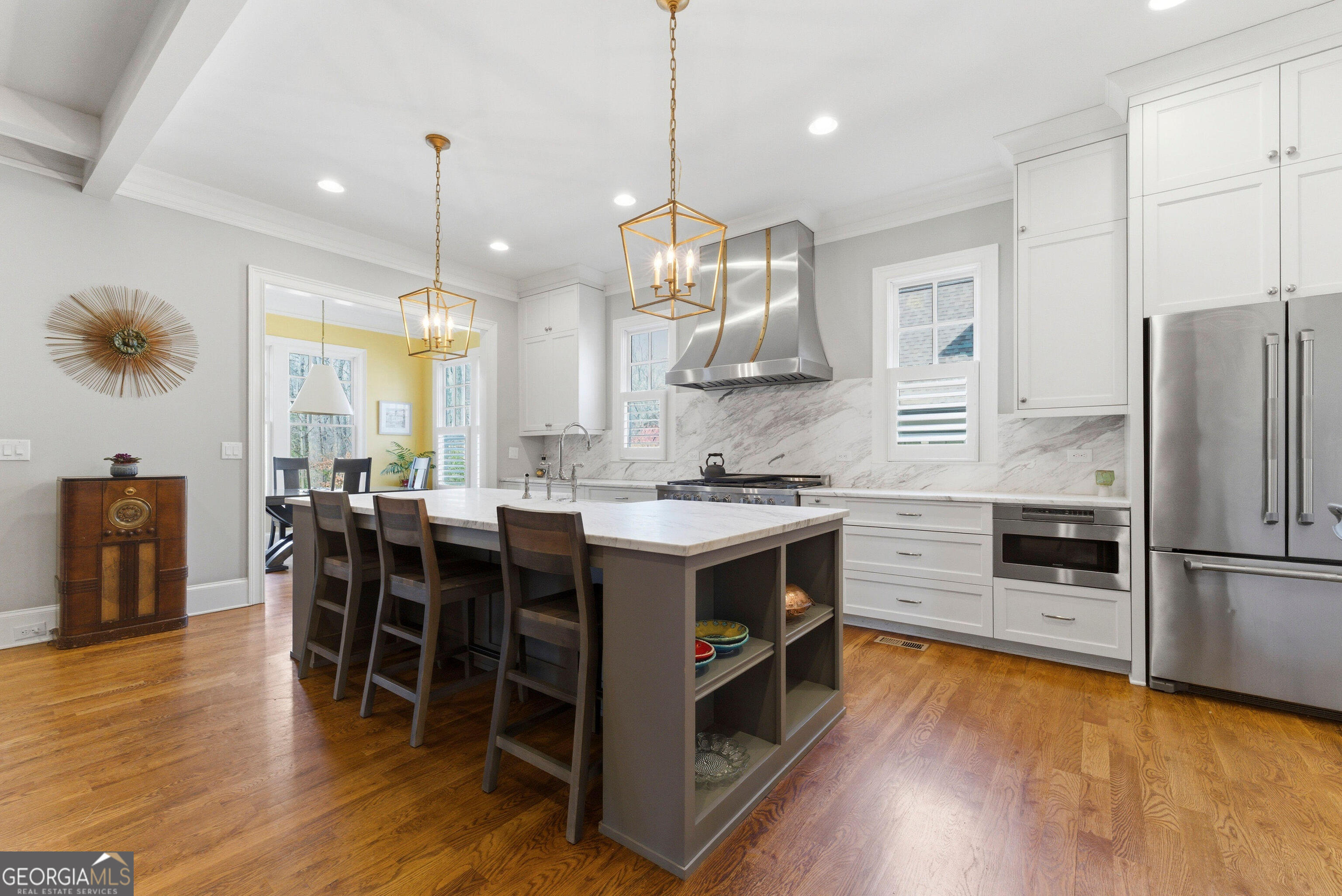 1205 Oldfield Road Decatur, GA 30030 - Photo 3 of 37 a kitchen with kitchen island granite countertop a sink a counter top space appliances and cabinets