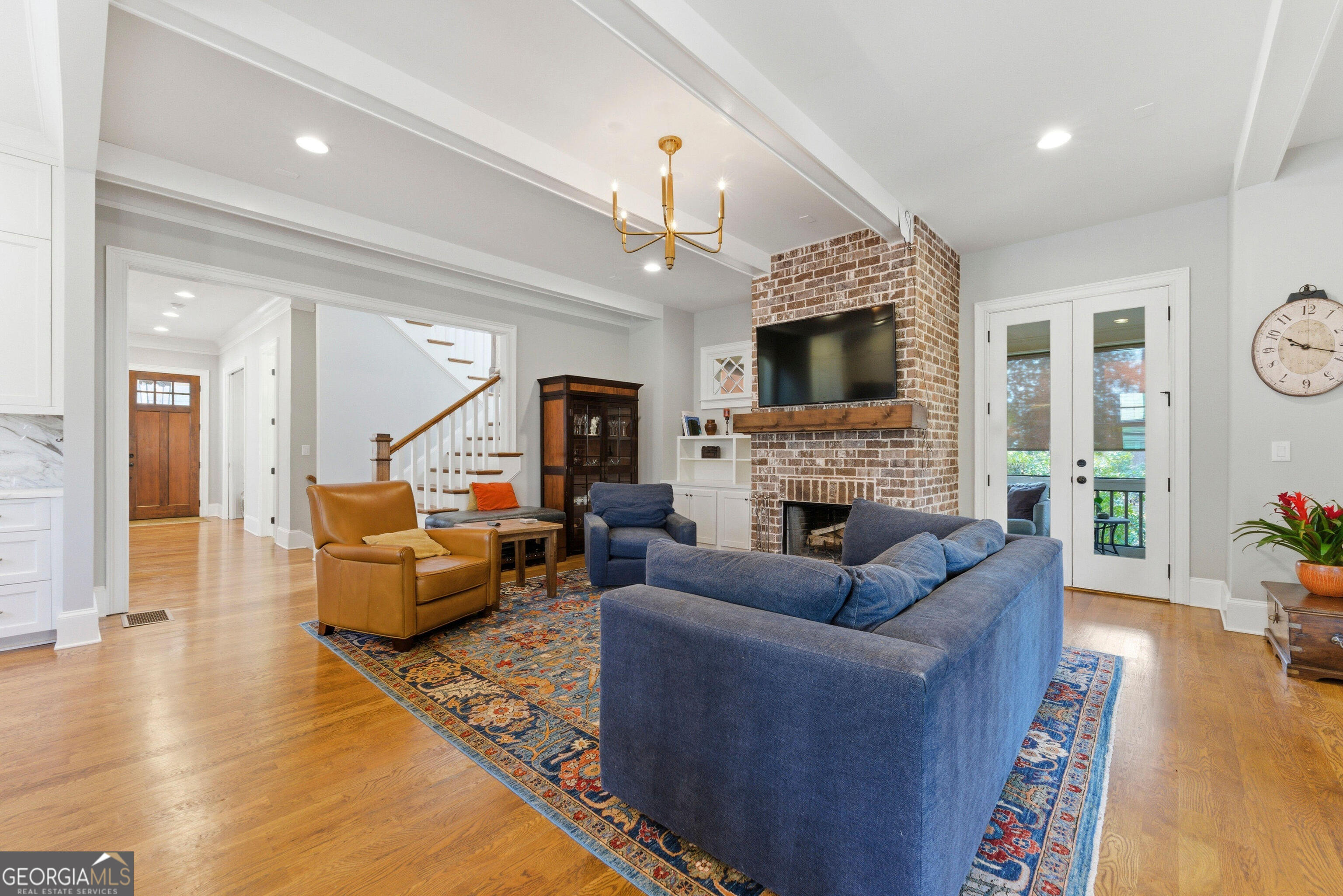 1205 Oldfield Road Decatur, GA 30030 - Photo 6 of 37 a living room with furniture fireplace and a flat screen tv