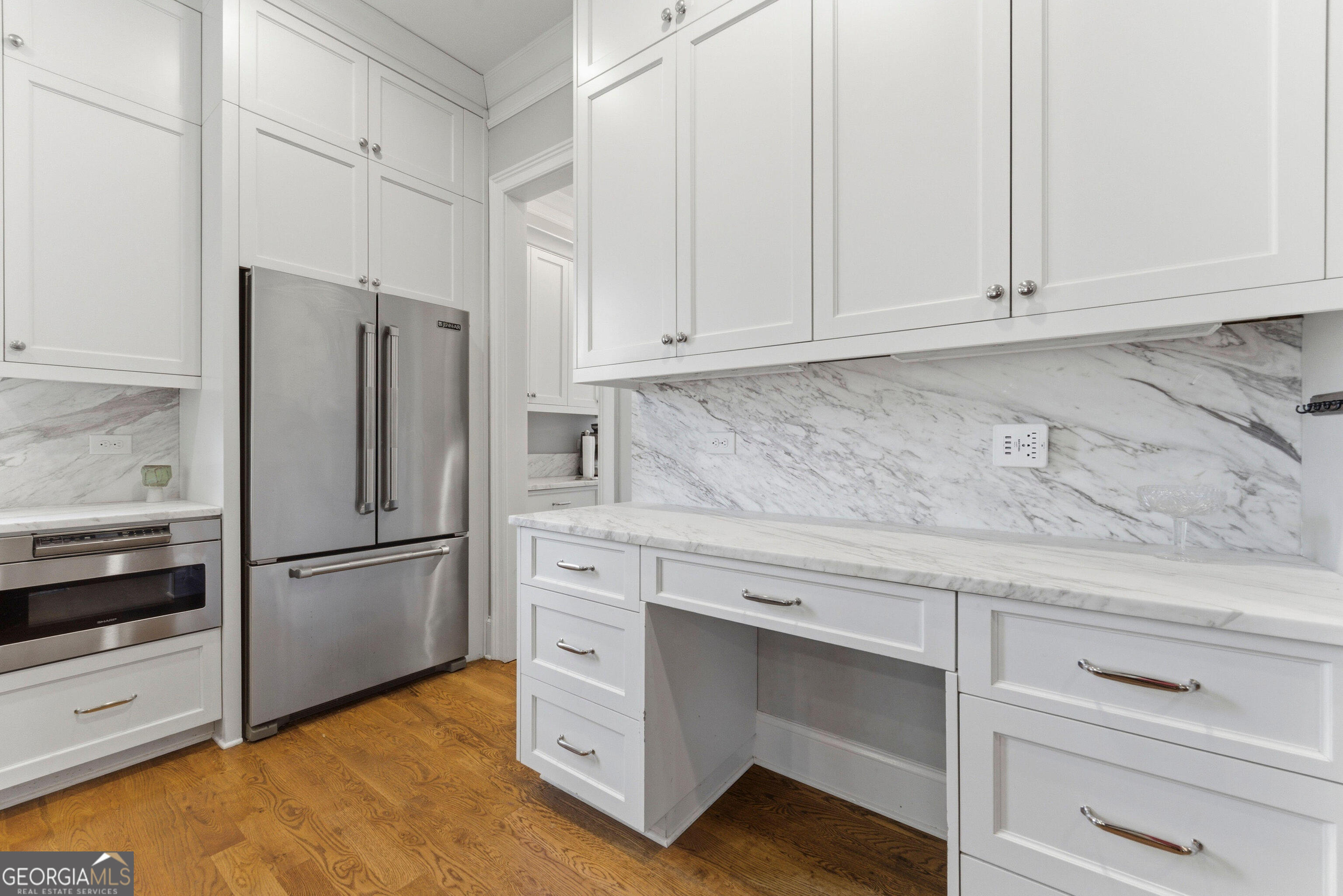 1205 Oldfield Road Decatur, GA 30030 - Photo 7 of 37 a kitchen with granite countertop white cabinets and stainless steel appliances
