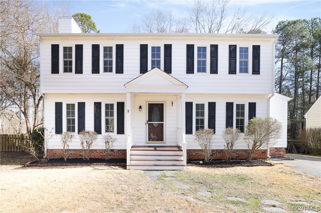 13802 Garrison Pl Drive Midlothian, VA 23112 - Photo 1 of 47 a front view of a building with a yard covered in snow