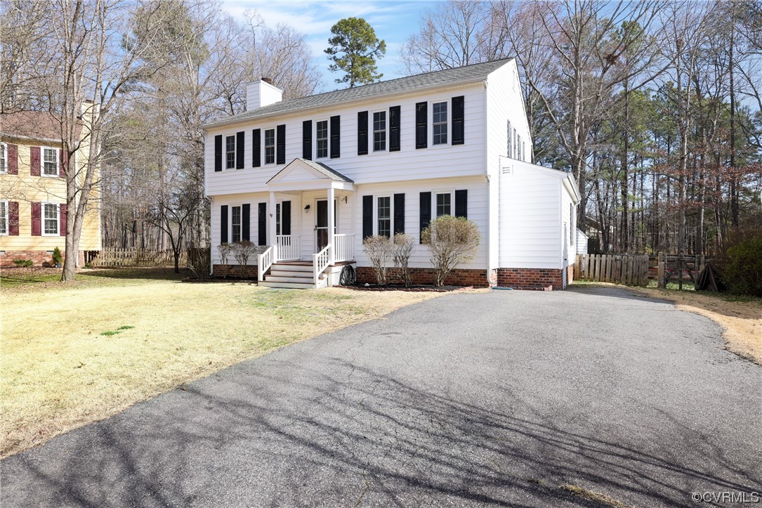 13802 Garrison Pl Drive Midlothian, VA 23112 - Photo 2 of 47 a front view of a building with a yard