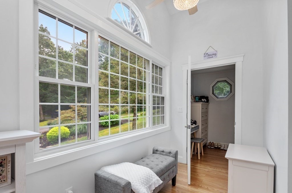 155 Whiting Street Hingham, MA 02043 - Photo 13 of 30 a view of a hallway with furniture and a window