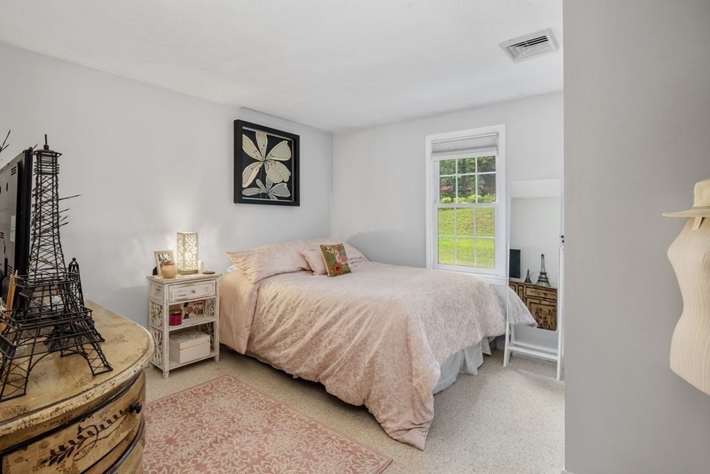 155 Whiting Street Hingham, MA 02043 - Photo 16 of 30 a bedroom with a bed and a couch