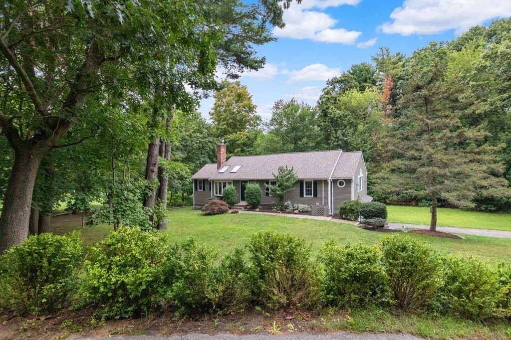 155 Whiting Street Hingham, MA 02043 - Photo 2 of 30 a view of a garden with a house in the background
