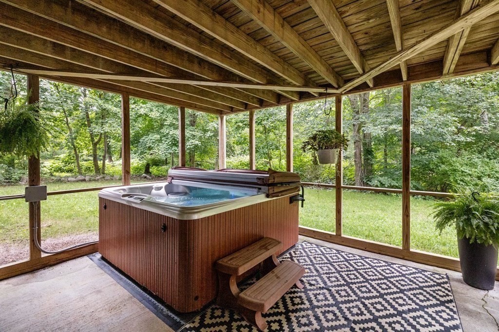 155 Whiting Street Hingham, MA 02043 - Photo 25 of 30 a view of a porch with furniture and garden