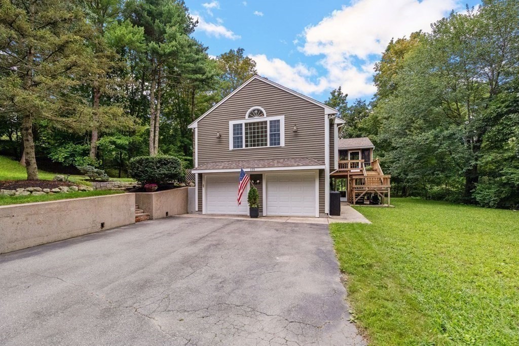 155 Whiting Street Hingham, MA 02043 - Photo 27 of 30 a front view of a house with a yard and garage