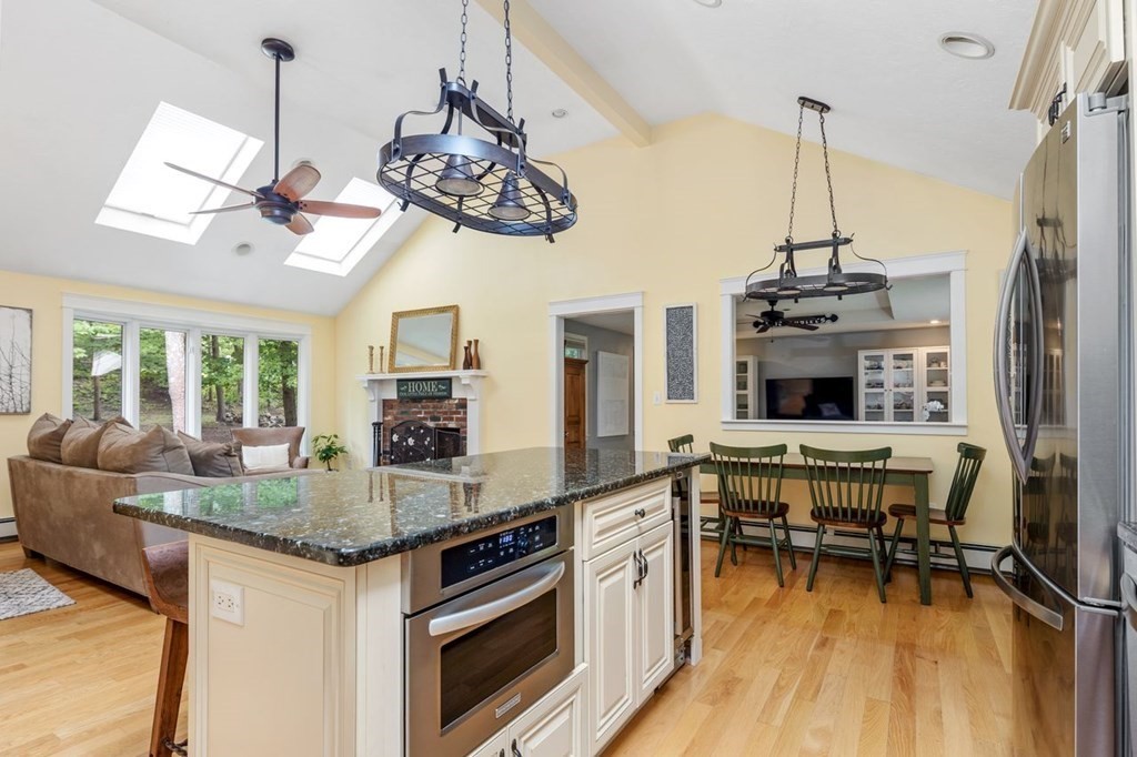 155 Whiting Street Hingham, MA 02043 - Photo 6 of 30 a kitchen with stainless steel appliances granite countertop a stove and a view of living room