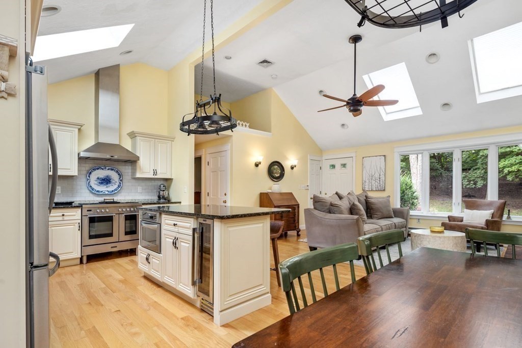 155 Whiting Street Hingham, MA 02043 - Photo 7 of 30 a kitchen with stove and wooden floor