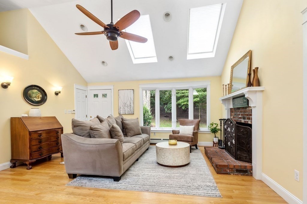 155 Whiting Street Hingham, MA 02043 - Photo 8 of 30 a living room with furniture and a fireplace