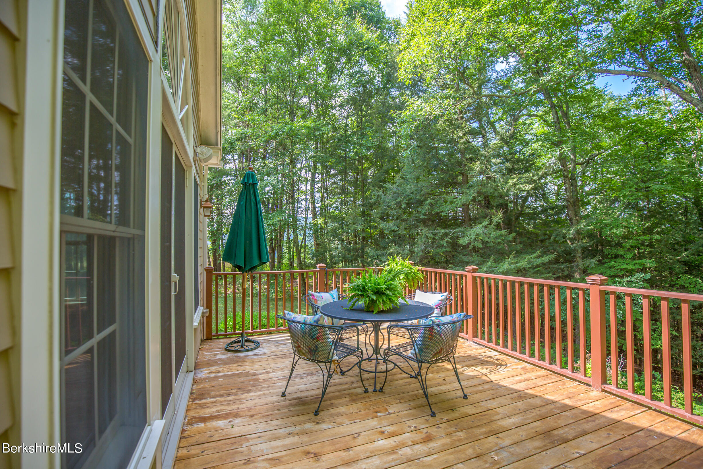 12 Castle Hill Road Stockbridge, MA 01262 - Photo 19 of 39 a view of a chair and tables in the balcony