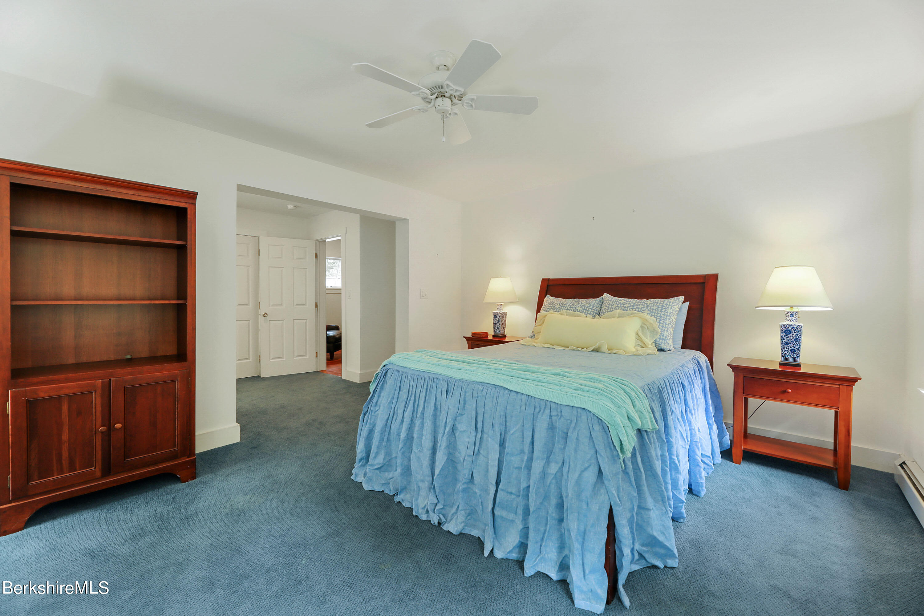12 Castle Hill Road Stockbridge, MA 01262 - Photo 23 of 39 a bedroom with a bed and a cabinets