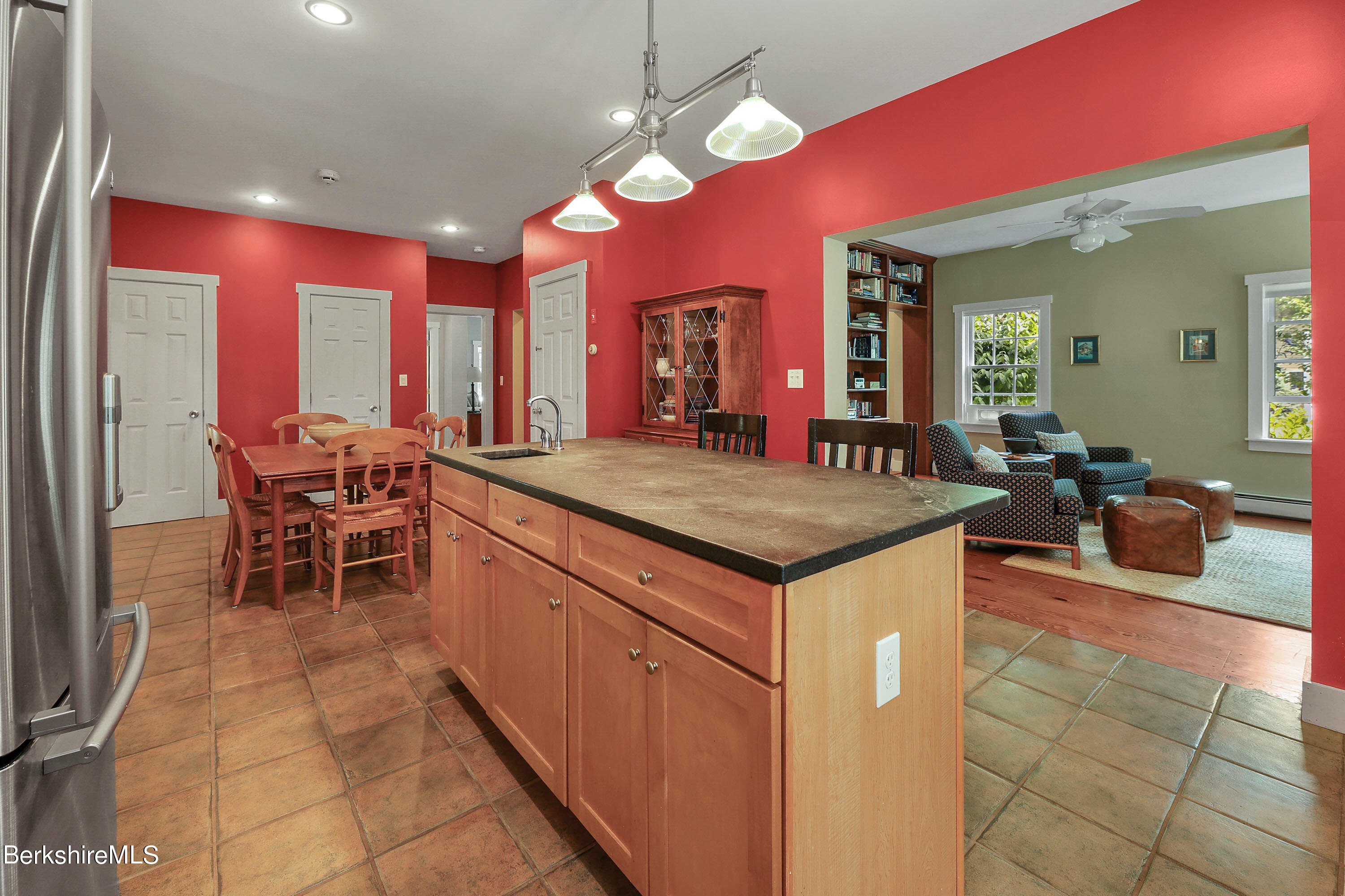 12 Castle Hill Road Stockbridge, MA 01262 - Photo 7 of 39 a kitchen with stainless steel appliances granite countertop dining table chairs and a large window
