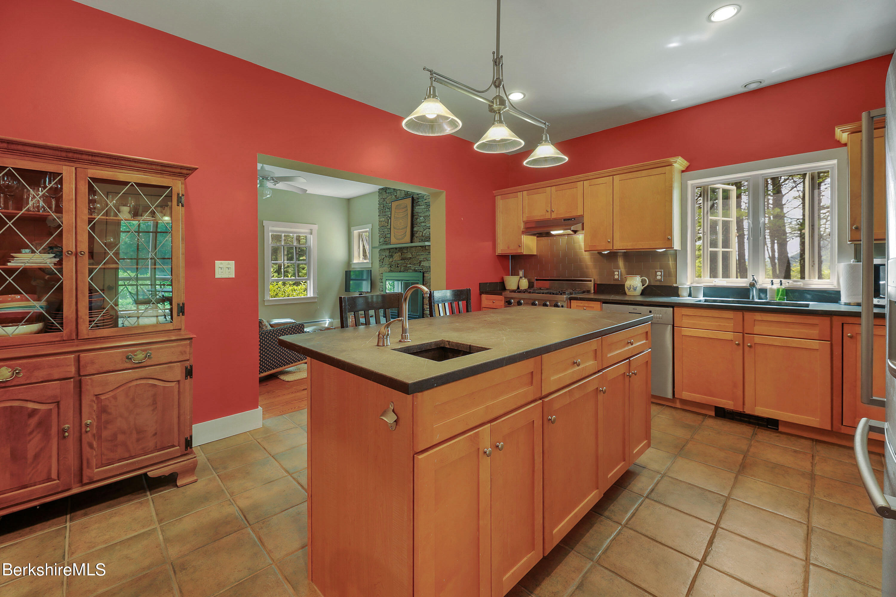 12 Castle Hill Road Stockbridge, MA 01262 - Photo 8 of 39 a kitchen with a sink stove and cabinets