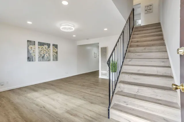 a view of an entryway with wooden floor