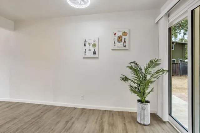 a spacious bathroom with a sink and a mirror