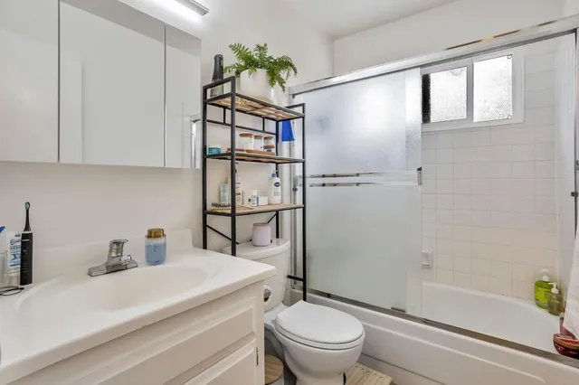 a bedroom with furniture and a wooden floor