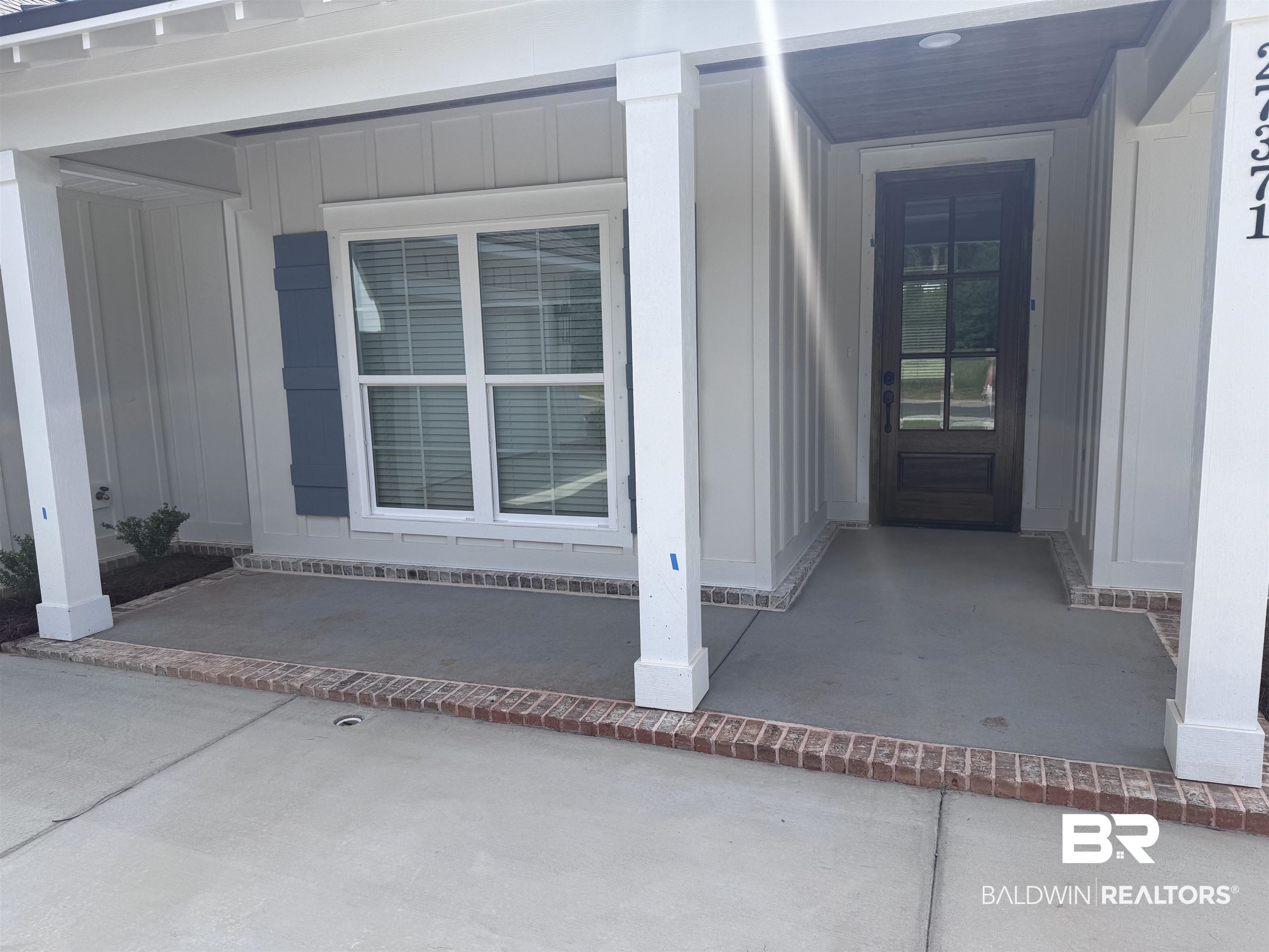 27371 Patch Pl Loop Daphne, AL 36526 - Photo 5 of 63 View of exterior entry featuring board and batten siding