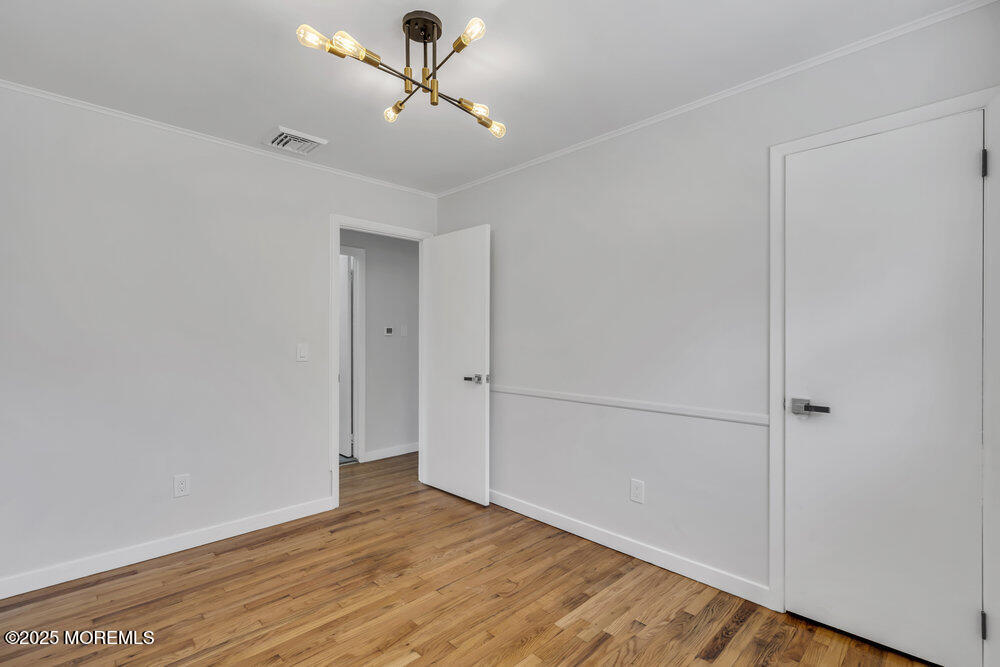 1202 Sunset Avenue Point Pleasant, NJ 08742 - Photo 18 of 23 a view of empty room with wooden floor