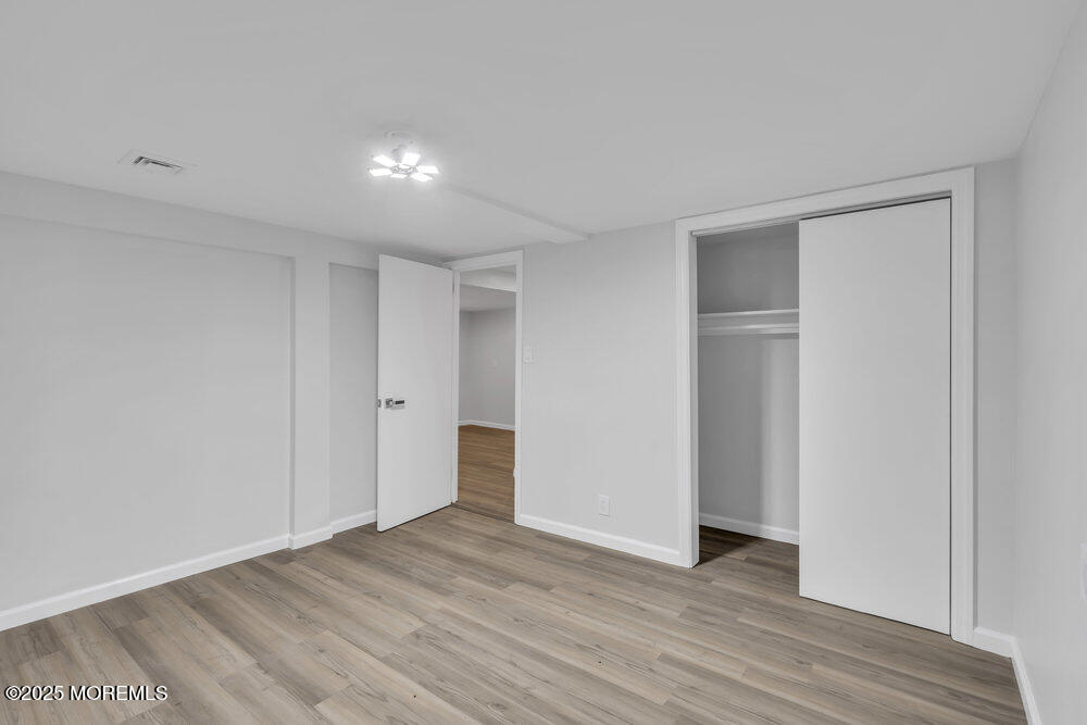 1202 Sunset Avenue Point Pleasant, NJ 08742 - Photo 23 of 23 a view of empty room with wooden floor