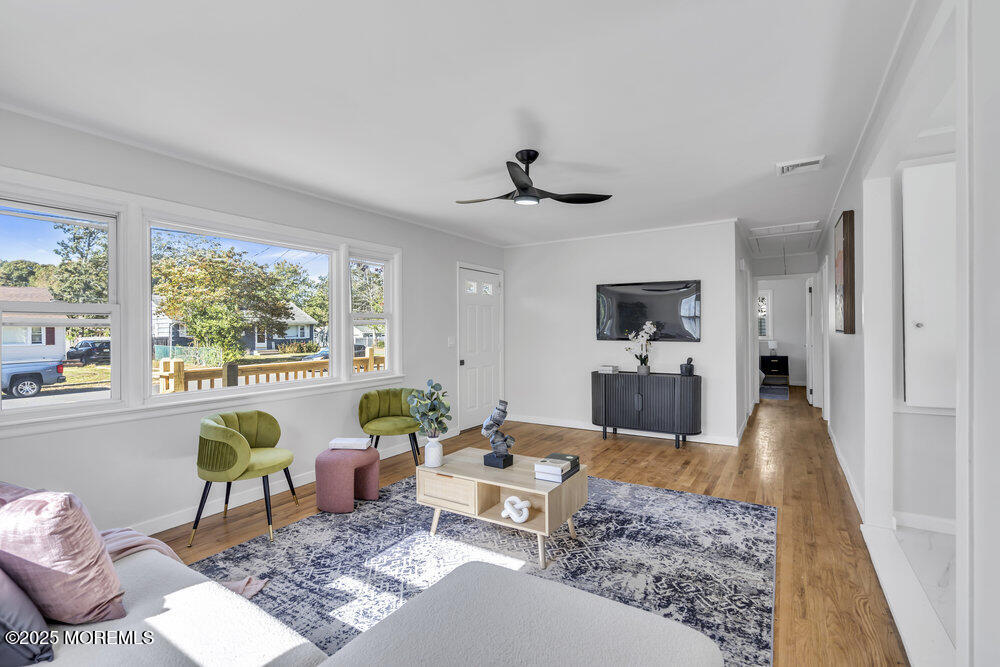 1202 Sunset Avenue Point Pleasant, NJ 08742 - Photo 5 of 23 a living room with furniture and a large window
