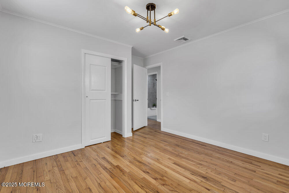 1202 Sunset Avenue Point Pleasant, NJ 08742 - Photo 8 of 23 a view of empty room with wooden floor