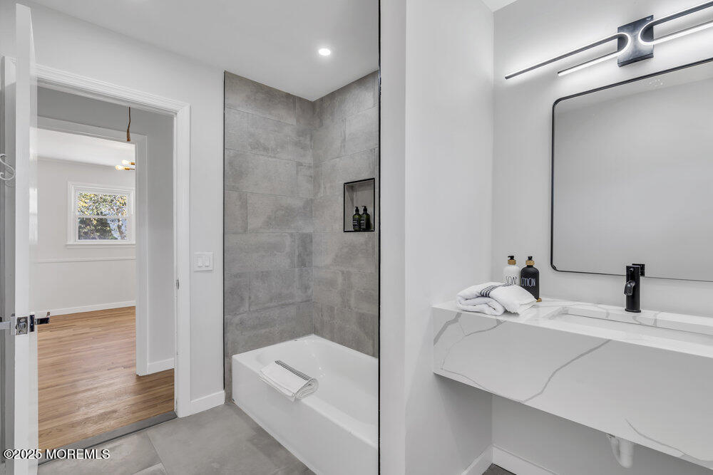1202 Sunset Avenue Point Pleasant, NJ 08742 - Photo 9 of 23 a bathroom with a sink and a mirror