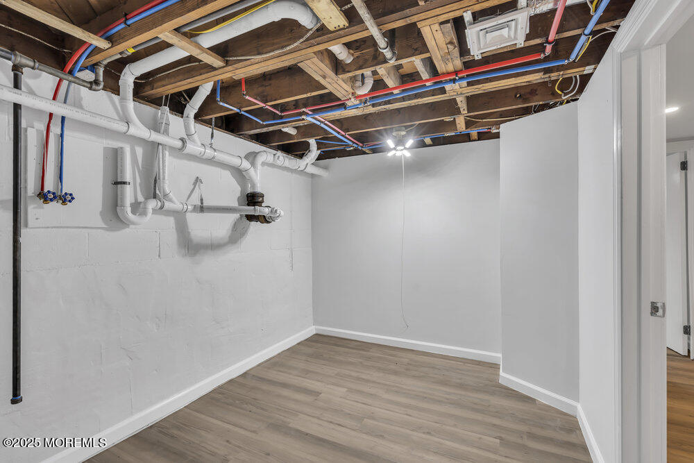 1202 Sunset Avenue Point Pleasant, NJ 08742 - Photo 10 of 23 a view of a room with racks on the wall