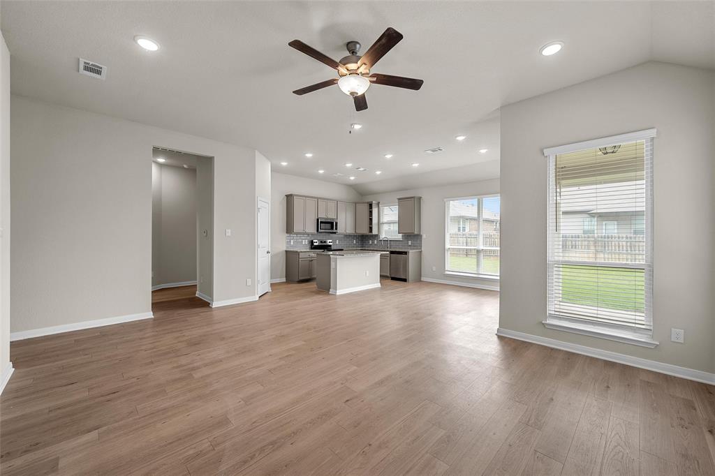 3224 Dottavio Road Lorena, TX 76655 - Photo 7 of 31 Expansive living area with wood-finish flooring, vaulted ceiling, and recessed lighting